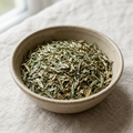 Illustrative image of dried tarragon in a ceramic bowl