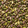 Shelled pistachio kernels filling a square frame