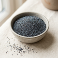 Illustrative image of culinary poppy seeds in a ceramic bowl