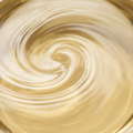 Close-up of pale golden castor oil filling a square frame