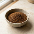 Illustrative image of chaga mushroom powder in a ceramic bowl