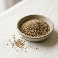 Illustrative image of dried celery seeds in a ceramic bowl