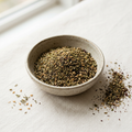 Illustrative image of zaatar-style seasoning in a ceramic bowl